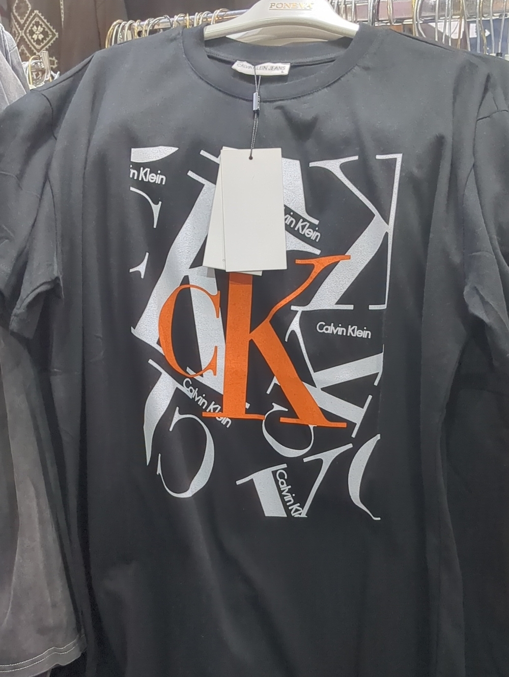 Calvin Klein Black Long-Sleeve Tee with Orange CK Graphic